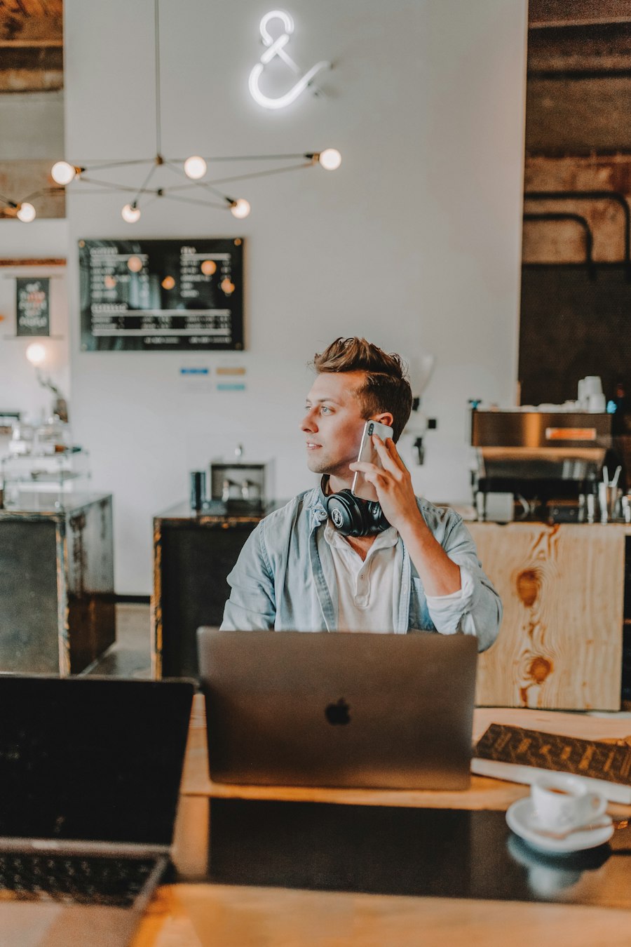 A business owner on the phone at a laptop